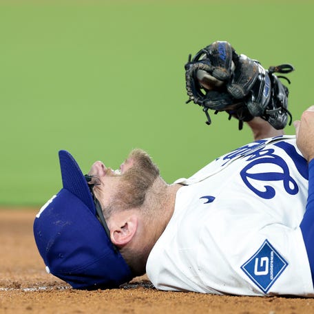 LOS ANGELES, CALIFORNIA - JULY 02: Max Muncy #13 of the Los Angeles Dodgers reacts after being injured during the sixth inning against the Chicago White Sox at Dodger Stadium on July 02, 2025 in Los Angeles, California. (Photo by Ronald Martinez/Getty Images)