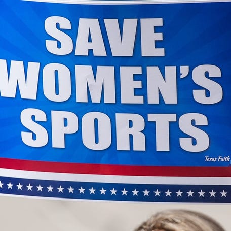 Rally goers support restrictions on transgender athletes during a 2023 demonstration on the steps of the Texas State Capitol.