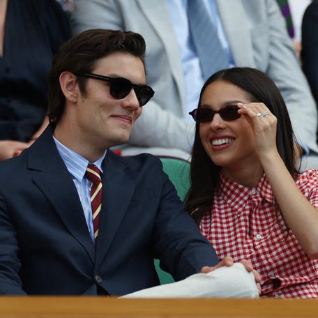Olivia Rodrigo with her partner and actor Louis Partridge in the Royal Box on Centre Court before the second round match between Spain's Carlos Alcaraz and Britain's Oliver Tarvet.