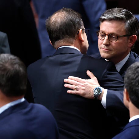 Speaker of the House Mike Johnson (R-LA) hugs a fellow members as the House of Representatives meets to vote on H.R. 1, the One, Big, Beautiful Bill Act in the House of Representatives at the U.S. Capitol on July 3, 2025 in Washington, D.C. The House is voting on the sweeping tax and spending bill after days of negotiating with Republican holdouts. The bill will make President Donald Trump's 2017 tax cuts permanent, increase spending on defense and immigration enforcement and   temporarily cut taxes on tips, while at the same time cutting funding for Medicaid, food assistance for the poor, clean energy and raises the nation's debit limit by $5 trillion.