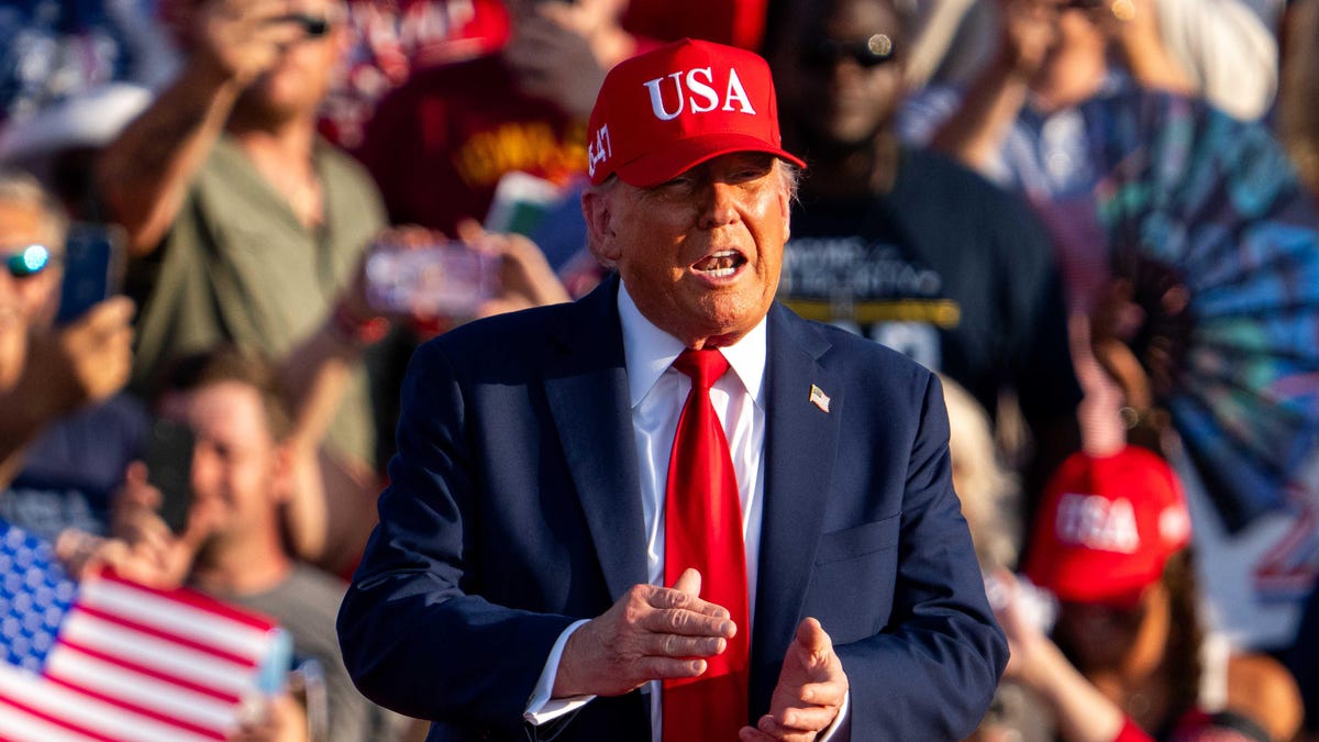 President Donald Trump takes the stage during the American 250 kickoff event on July 3, 2025, at the Iowa State Fairgrouds.