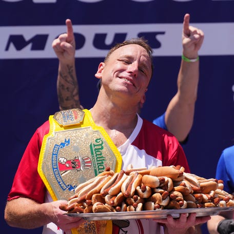 NEW YORK, NEW YORK - JULY 4: Joey Chestnut wins the men's competition at Nathan's Annual Hot Dog Eating Contest on July 4, 2025 in New York City. Joey Chestnut makes his return to the Nathan's Famous 4th of July Hot Dog Eating Contest to compete for a 17th win after missing the 2024 event due to a sponsorship dispute with Major League Eating. (Photo by Adam Gray/Getty Images)