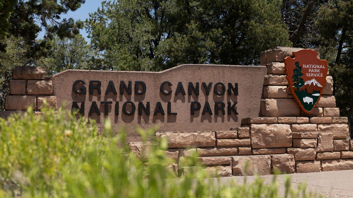 The Grand Canyon National Park welcome sign is seen from a view near Tusayan, Arizona, U.S. June 28, 2025. REUTERS/Kaylee Greenlee