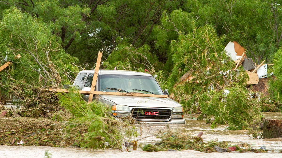 Record-breaking flooding swept cars and debris after 14 inches of rainfall in San Angelo, Texas on Friday, July 4, 2025.