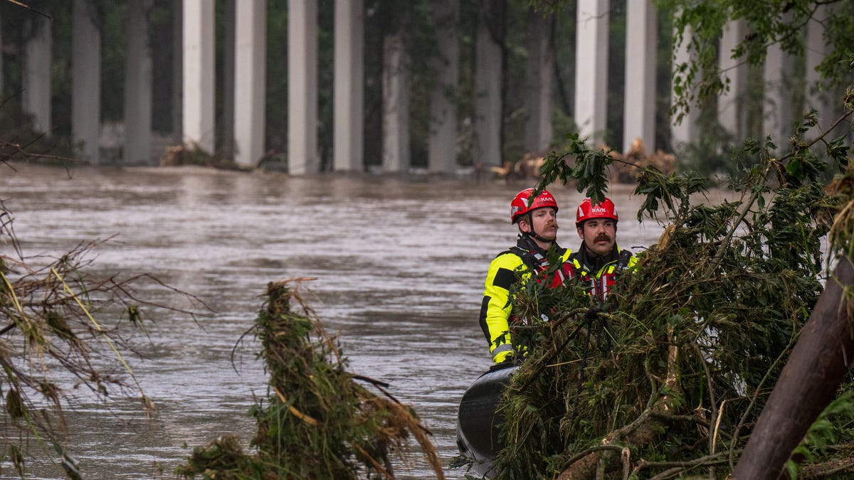 Trees emerge from flood waters along the Guadalupe River on July 4, 2025, in Kerrville, Texas. Heavy rainfall caused flooding along the Guadalupe River in central Texas with multiple fatalities reported.