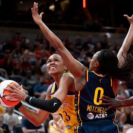 Indiana Fever guard Kelsey Mitchell (0) guards Los Angeles Sparks forward Azura Stevens (23) Saturday, July 5, 2025, at Gainbridge Fieldhouse in Indianapolis.