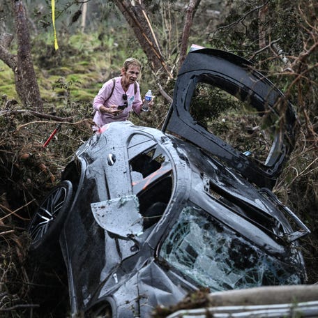 A volunteer looks for missing people, following severe flash flooding that occurred during the July 4 holiday weekend, in Hunt, Texas, on July 6, 2025. Rescuers in Texas raced against time Sunday to find dozens of missing people, including children, swept away by flash floods that killed at least 59, as forecasters warned of new deluges. Local Texans joined forces with disaster officials to search through the night for the missing, including 27 girls from a riverside Christian summer camp. Texas   Governor Greg Abbott said Camp Mystic on the banks of the Guadalupe River, where some 750 girls had been staying when the floodwaters hit, had been "horrendously ravaged in ways unlike I've seen in any natural disaster."