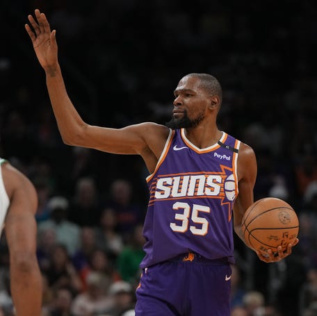 Phoenix Suns forward Kevin Durant calls out a play against the Boston Celtics during the first half at Footprint Center.