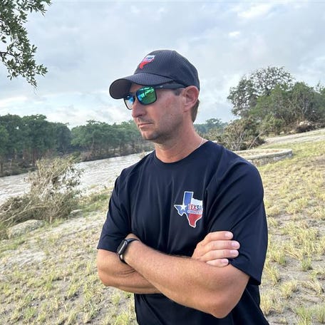 Jonathan McComb surveys the Guadalupe River at a staging area before heading out with a search-and-rescue team to look for victims of the recent Kerr County floods. McComb survived the 2015 floods in Wimberley, 80 miles east of Kerr County, but lost his wife and two children and vowed to help others if he survived.