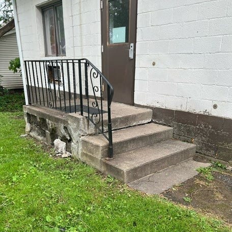 Shown are crumbling stairs at an adult care facility in New York that state auditors found as part of an investigation of state health officials failure to properly inspect the facilities.
