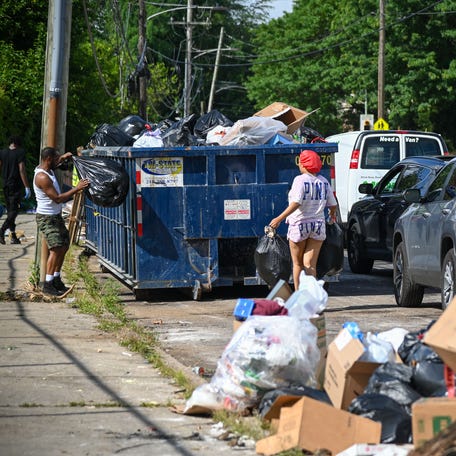 Local residents drop off trash at a designated site in Philadelphia on July 7, 2025 as the AFSCME Union District Council 33 and the City of Philadelphia suspended negotiations. District Council 33 is the largest worker's union in the city and it's members provide critical services to the city.