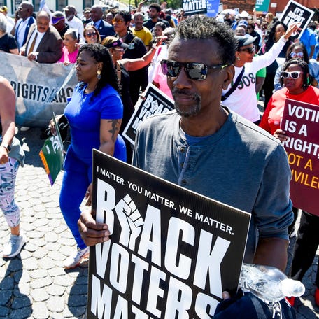 Fred Graham carries a Black Voters Matter during the This Side of the Bridge March to the Capitol in Montgomery, Ala., on Sunday March 23, 2025 celebrating the 60th Anniversary of the Selma to Montgomery March.