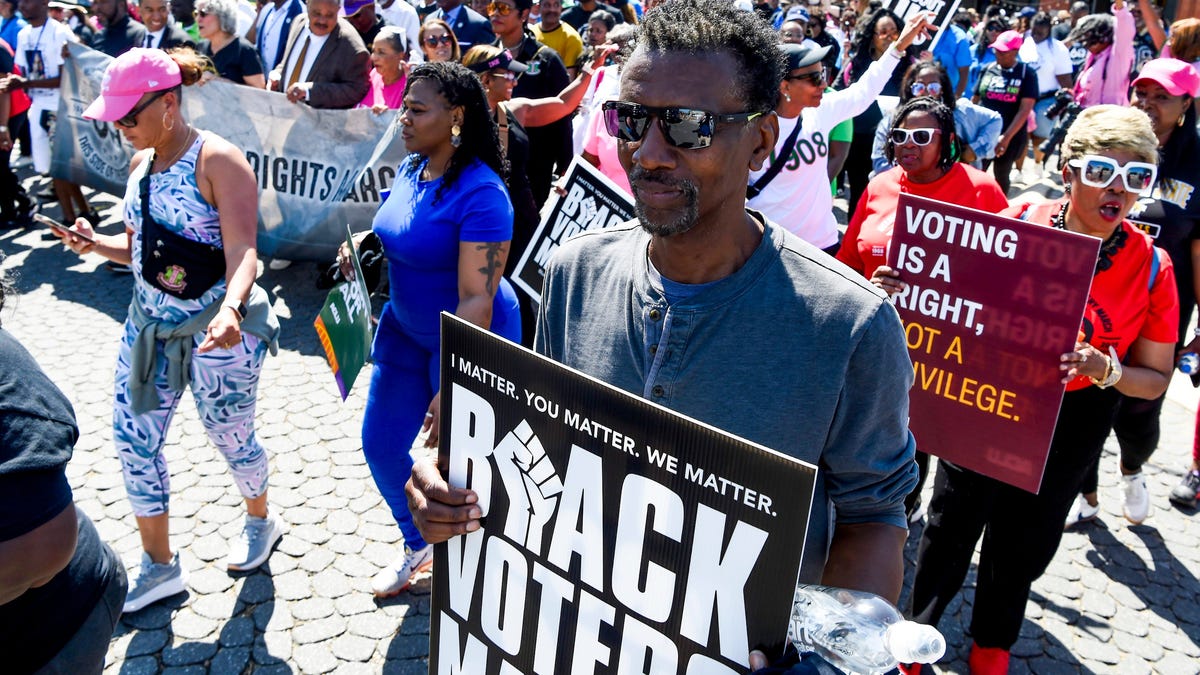 Fred Graham carries a Black Voters Matter during the This Side of the Bridge March to the Capitol in Montgomery, Ala., on Sunday March 23, 2025 celebrating the 60th Anniversary of the Selma to Montgomery March.