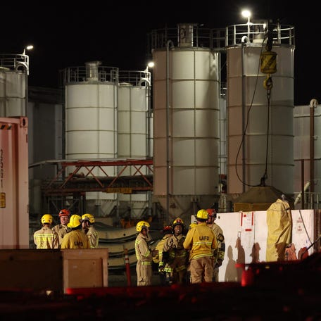 Los Angeles Fire Department (LAFD) firefighters are seen at the site of an industrial tunnel collapse in the Wilmington neighborhood of Los Angeles on July 9, 2025. 31 workers were safely removed from the tunnel without visible injuries, the LAFD said on July 9.