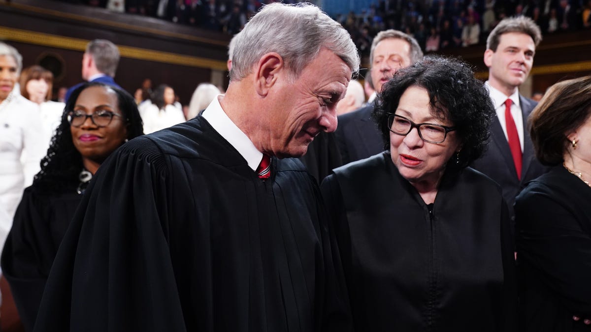 Supreme Court Chief Justice chats with Justice Sonia Sotomayor in the House of Representatives ahead of President Joe Biden's State of the Union address on March 7, 2024.