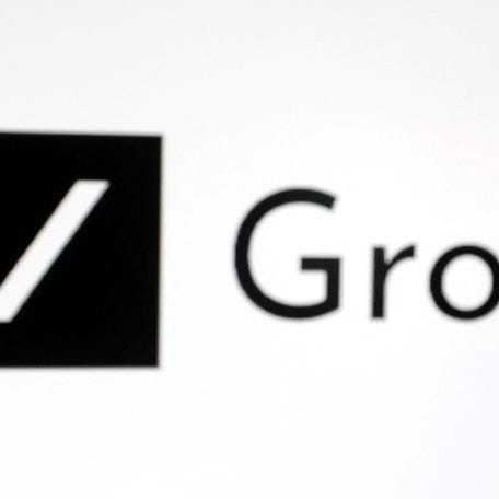 A 3D-printed miniature model of Elon Musk and Grok logo are seen in this illustration taken, February 16, 2025.