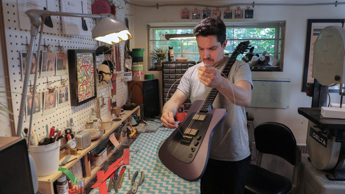 Custom guitar-maker Florian Bouyou at his home workshop in Montreal.