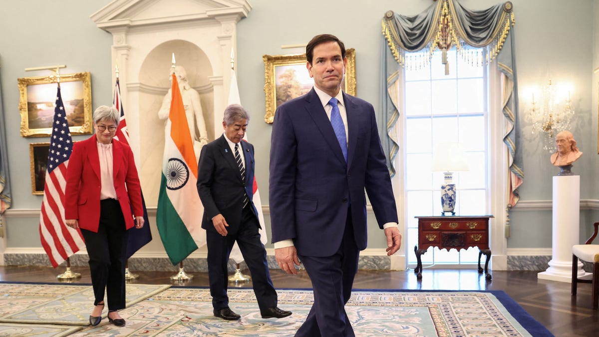 FILE PHOTO: U.S. Secretary of State Marco Rubio leads Australia’s Foreign Minister Penny Wong and Japanese Foreign Minister Takeshi Iwaya to the meeting of the Indo-Pacific Quad at the State Department in Washington, D.C., U.S., July 1, 2025. REUTERS/Kevin Lamarque/File Photo
