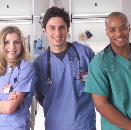 "Scrubs" stars Sarah Chalke, Zach Braff and Donald Faison pose for a publicity photo.