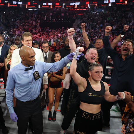 Katie Taylor celebrates after defeating Amanda Serrano by a majority decision in their undisputed IBF, WBA, WBC, WBO, and Ring super lightweight championship bout.