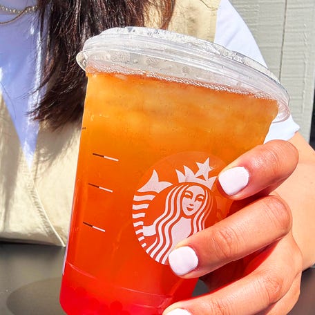 IMAGE EMBARGOED UNTIL MONDAY, JULY 14 AT 6 A.M. ET: Starbucks is adding a secret drinks menu to its app and is conducting a contest to find new favorite drink hacks. Shown here: Black tea and lemonade with raspberry-flavored popping pearls.