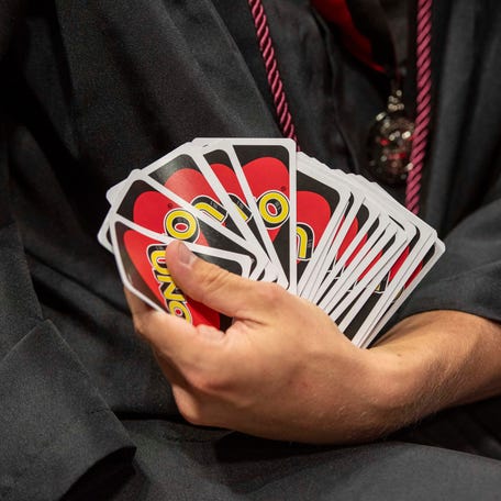 A deck of Uno cards on display.