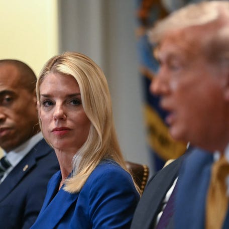 (L/R) US Secretary of Housing and Urban Development Scott Turner and Attorney General Pam Bondi look on as President Donald Trump speaks during a cabinet meeting in the Cabinet Room of the White House in Washington, DC, on July 8, 2025.
