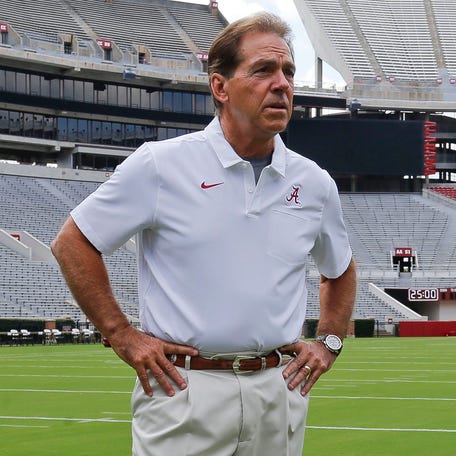 Alabama football coach Nick Saban stands on the turf inside Bryant-Denny Stadium during his team's media day in 2019.