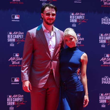 National League pitcher Paul Skenes of the Pittsburgh Pirates and social media influencer Livvy Dunne pose for a photo on the red carpet before the 2025 MLB All Star Game at Truist Park.