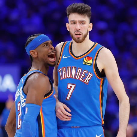 Oklahoma City Thunder guard Shai Gilgeous-Alexander (2) and forward Chet Holmgren (7) celebrate after a play against the Minnesota Timberwolves in the third quarter during game two of the western conference finals for the 2025 NBA Playoffs at Paycom Center on May 22, 2025.