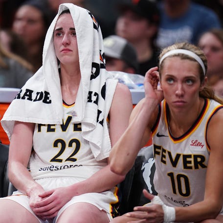 Indiana Fever guard Caitlin Clark (22) reacts on the bench after a play against the Connecticut Sun in the second half at TD Garden.