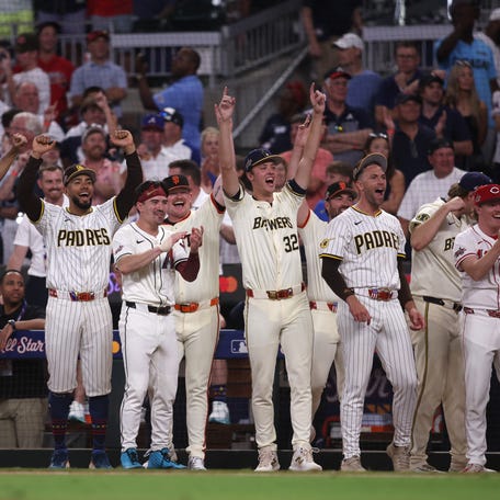 NL players celebrate during the tiebreaker.