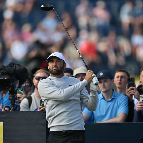 US golfer Scottie Scheffler watches his shot from the 14th tee during practice ahead of the 153rd Open Championship at Royal Portrush golf club in Northern Ireland on July 16, 2025. (Photo by Glyn KIRK / AFP)