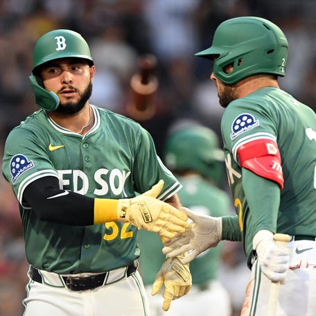 Boston's Wilyer Abreu and Alex Bregman.