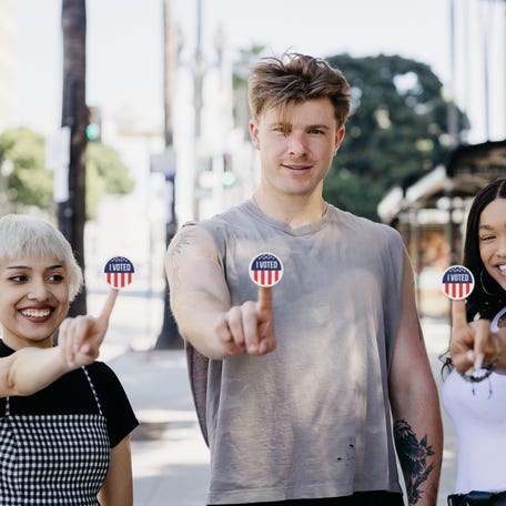 Portrait of young people just voted out of the poll place.