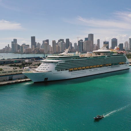 An aerial view from a drone shows Royal Caribbean's Navigator of the Seas cruise ship docked at PortMiami on March 02, 2021.