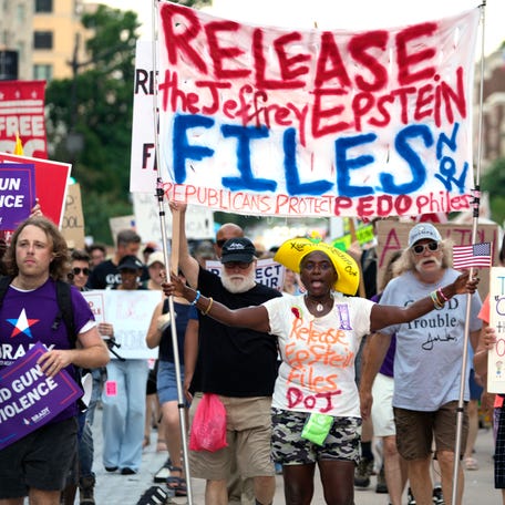 Nadine Seiler of Waldorf, Md., center, joins the rally during the "Good Trouble Lives On" protests in Washington, D.C., on July 17, 2015. Tens of thousands of protesters are expected to gather at more than 1,600 locations nationwide to rally against many of the Trump administration's policies.