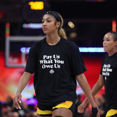Team Collier forward Angel Reese in the WNBA All-Star's "Pay Us What You Owe Us" shirts.