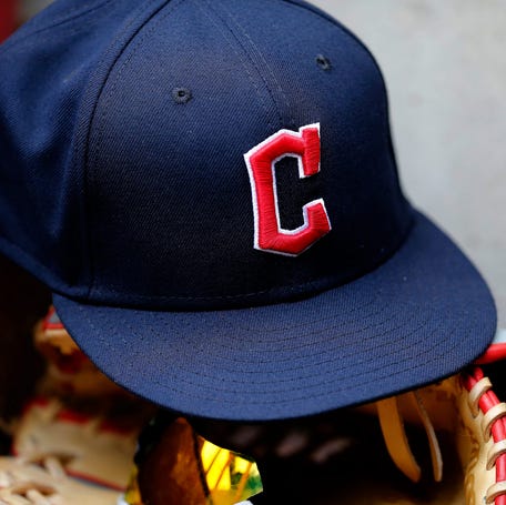 A ball cap sports the Cleveland Guardians logo in the third inning of the MLB Inter-league game between the Cincinnati Reds and the Cleveland Guardians at Great American Ball Park in downtown Cincinnati.