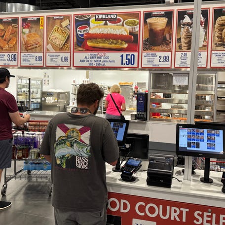Costco members place orders in the food court area inside the Costco Wholesale membership warehouse club store at One Daytona in Daytona Beach on Saturday, July 19, 2025.
