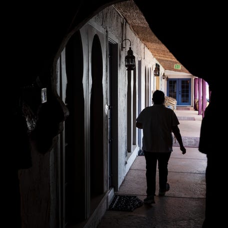 A housekeeper takes supplies to rooms at a hotel in Riverside County, California in this file photo from Feb. 11, 2021.