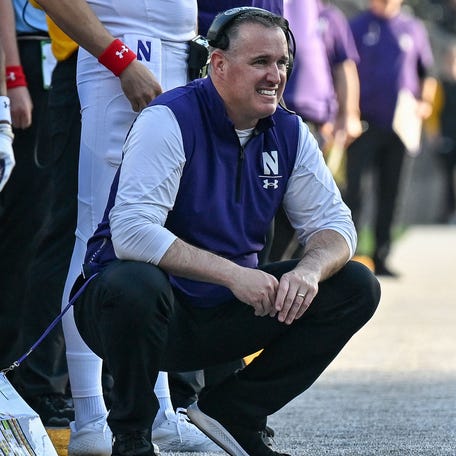 Northwestern coach Pat Fitzgerald looks on during his team's 2022 game against Iowa at Kinnick Stadium.
