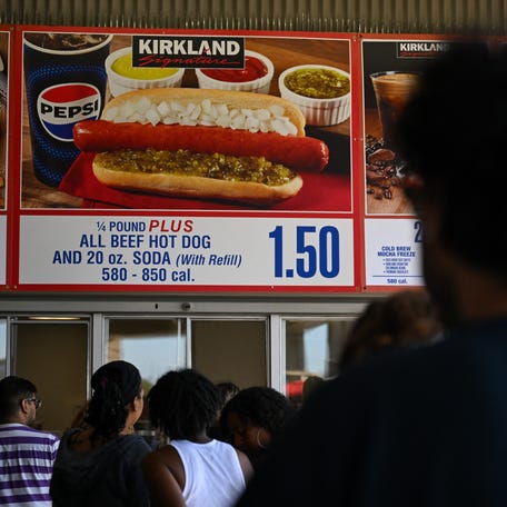 Customers wait in line on June 12, 2024 to order the Costco Kirkland Signature $1.50 hot dog and soda combo, which has maintained the same price since 1985 despite consumer price increases and inflation, at the food court outside a Costco Wholesale Corp. warehouse store in Inglewood, California.