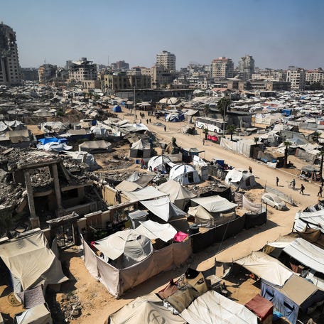 Palestinians, displaced by the Israeli offensive, shelter in tents in Gaza City, July 22, 2025.