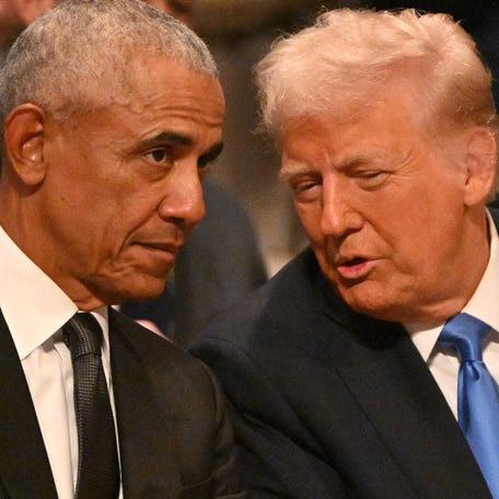 Former President Barack Obama and President-elect Donald Trump attend the funeral service for former President Jimmy Carter at the Washington National Cathedral in Washington, DC, on Jan. 9, 2025.