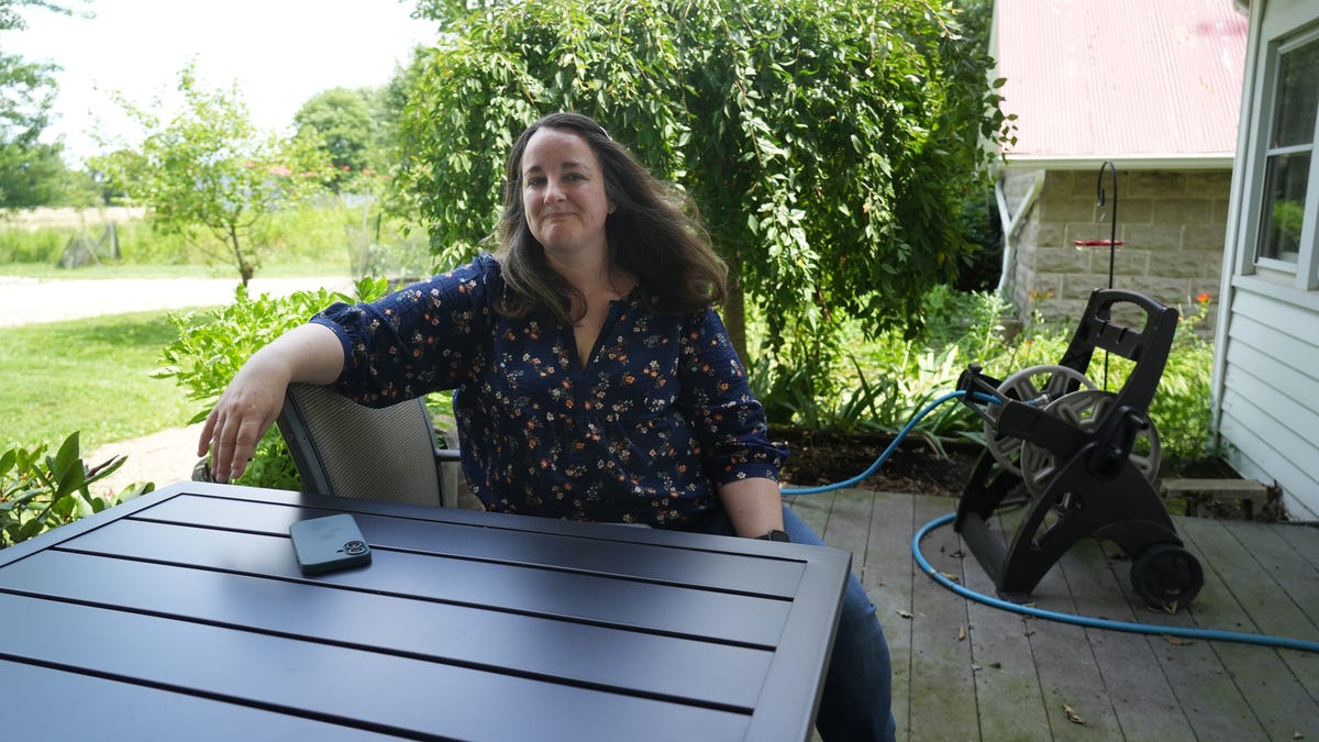 Angie Scheu, 44, says she frequently just sits on her back porch watching birds to escape the stress of raising three children. Her youngest, Rachel, has Down syndrome.