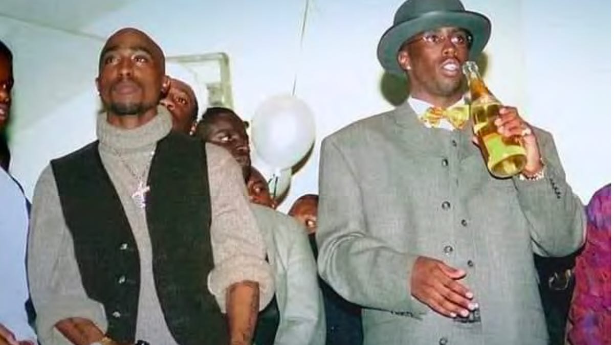 Tupac Shakur (left) and Sean Combs are shown together in this undated photo.