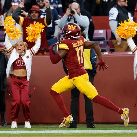 Nov 24, 2024; Landover, Maryland, USA; Washington Commanders wide receiver Terry McLaurin (17) scores a touchdown in the final minute of the fourth quarter against the Dallas Cowboys at Northwest Stadium. Mandatory Credit: Geoff Burke-Imagn Images