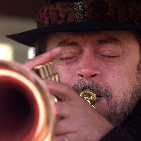 Chuck Mangione plays his trumpet at the opening of the 26th annual fox hunt at Hopper Hills Hunt Club in Victor in 1997.