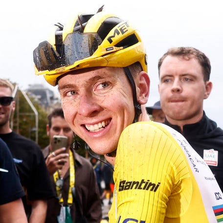 UAE Team Emirates XRG's Tadej Pogacar reacts while wearing the yellow jersey after stage 21 to win the Tour de France.